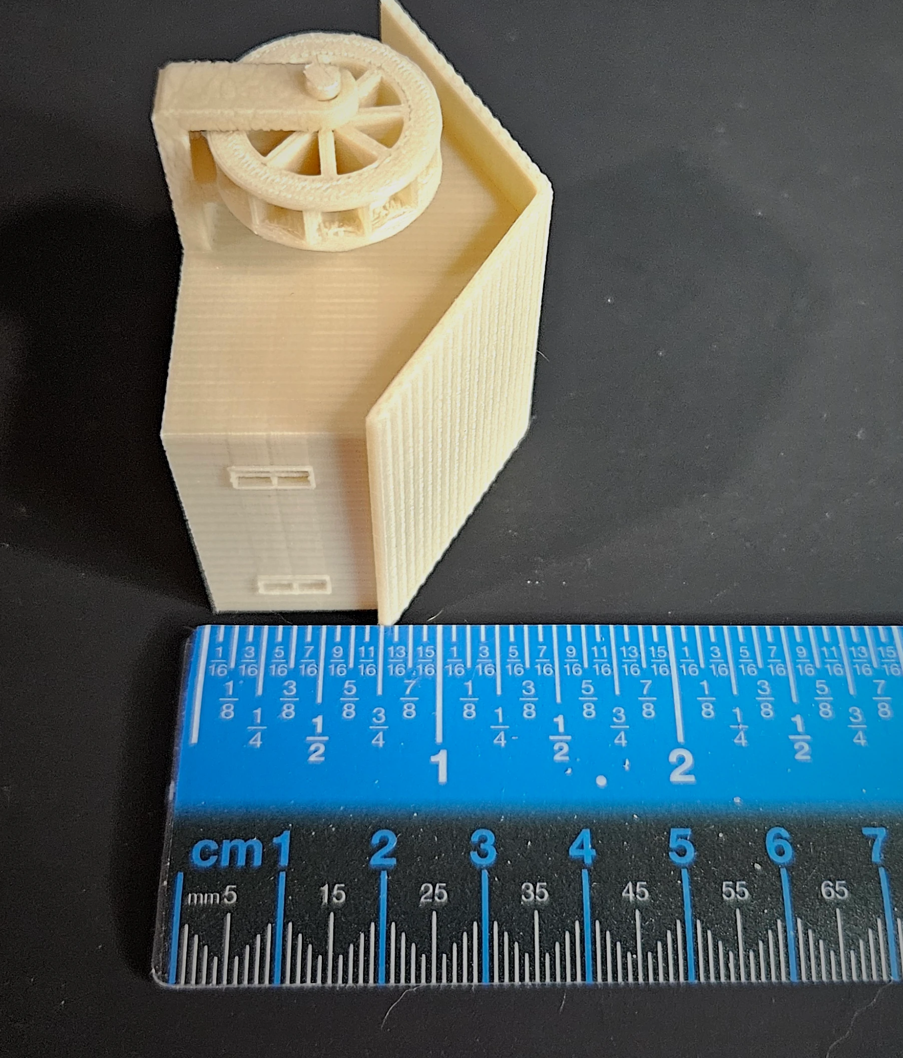 Painted example of HO scale waterwheel with large building